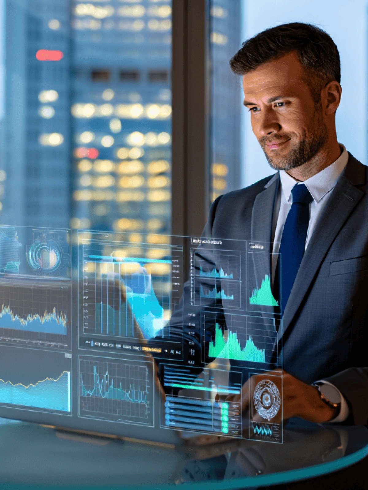 Two colleagues laughing while using a laptop